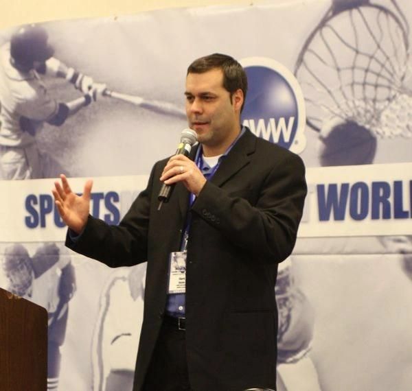 Mark Washo speaking at a sports industry event
